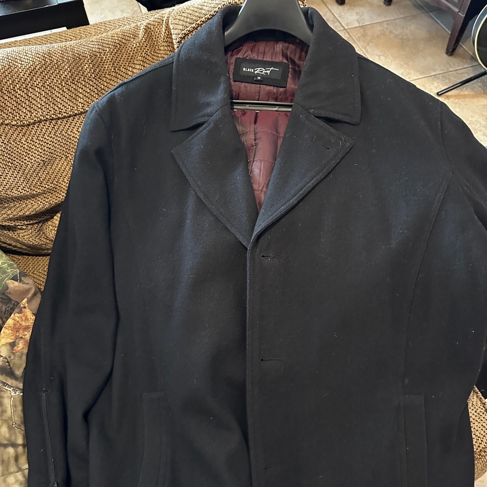 Used wool peacoat style men’s coat with zip in hood. Missing one button.